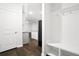 Hallway featuring a mudroom area with coat hooks, bench, and storage cubbies, leading to kitchen at 332 Long Pier St, Summerville, SC 29486