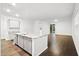 Open-concept kitchen with a large island, stainless steel dishwasher, and plenty of counter space at 332 Long Pier St, Summerville, SC 29486