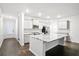 Bright kitchen with a large center island, stainless steel appliances, and ample cabinet space at 332 Long Pier St, Summerville, SC 29486