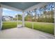 Inviting screened porch offering views of the backyard and neighborhood at 332 Long Pier St, Summerville, SC 29486