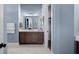 Bathroom vanity featuring a brown cabinet, white countertop, and decorative accents at 352 Trailmore Ln, Summerville, SC 29486