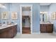 Double sink bathroom features vanity and a view into a walk-in closet at 352 Trailmore Ln, Summerville, SC 29486