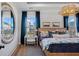 Bedroom with a round mirror, hardwood floors, and lots of natural light from two windows at 352 Trailmore Ln, Summerville, SC 29486