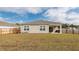Well-maintained backyard with a covered patio, level lawn, and wooden privacy fence at 369 Spruce Ivy St, Moncks Corner, SC 29461