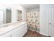 Bathroom with a double sink vanity, wood-look floors, and shower at 369 Spruce Ivy St, Moncks Corner, SC 29461