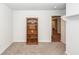 Spare bedroom with a natural wood bookcase and neutral carpet flooring at 369 Spruce Ivy St, Moncks Corner, SC 29461