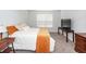 A well-lit bedroom with a bed, wooden furniture, and a carpet at 369 Spruce Ivy St, Moncks Corner, SC 29461