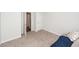 Empty bedroom with an open door and neutral-colored carpet at 369 Spruce Ivy St, Moncks Corner, SC 29461