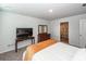 Bright bedroom featuring a television and ensuite bathroom with a shower at 369 Spruce Ivy St, Moncks Corner, SC 29461