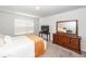 Cozy bedroom featuring white walls, carpet, and wood furniture at 369 Spruce Ivy St, Moncks Corner, SC 29461