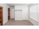 Spare bedroom featuring neutral walls, carpeted floors, with a closet and small window at 369 Spruce Ivy St, Moncks Corner, SC 29461
