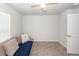 This bright bedroom features a loveseat and fan at 369 Spruce Ivy St, Moncks Corner, SC 29461