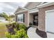 Charming home featuring a landscaped front yard and inviting entryway at 369 Spruce Ivy St, Moncks Corner, SC 29461