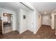 Bright hallway with wood floors and white doors leading to various rooms at 369 Spruce Ivy St, Moncks Corner, SC 29461