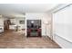 Comfortable living area with modern entertainment center, natural light from the window, and neutral decor creating a relaxing ambiance at 369 Spruce Ivy St, Moncks Corner, SC 29461