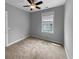 Comfortable bedroom with neutral walls, carpeted floor, bright window and ceiling fan at 3700 Maidstone Dr, Mount Pleasant, SC 29466