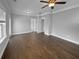 Spacious bedroom with a ceiling fan, hardwood floors, neutral walls, and access to walk-in closet at 3700 Maidstone Dr, Mount Pleasant, SC 29466