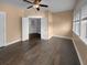 Bedroom with hardwood floors, a ceiling fan, neutral walls, and ample closet space at 3700 Maidstone Dr, Mount Pleasant, SC 29466