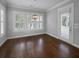Bright dining area with a modern light fixture, hardwood flooring, and access to a porch at 3700 Maidstone Dr, Mount Pleasant, SC 29466