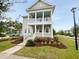 Charming two-story home with a double porch, landscaped yard, and sidewalk access at 3700 Maidstone Dr, Mount Pleasant, SC 29466