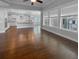 Spacious living room with hardwood floors, lots of natural light and an open view to the kitchen at 3700 Maidstone Dr, Mount Pleasant, SC 29466