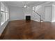 Light-filled living room showcases hardwood floors, a fireplace, and stairs to the second level at 3700 Maidstone Dr, Mount Pleasant, SC 29466