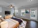 Well-lit main bedroom features a ceiling fan, balcony access, and a modern aesthetic at 3700 Maidstone Dr, Mount Pleasant, SC 29466