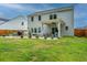 Backyard featuring a patio, an outdoor seating area under a pergola, and a well-maintained lawn at 4314 Cotton Flt Rd, Summerville, SC 29485