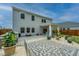 Backyard featuring a patio with elegant pavers, an outdoor seating area under a pergola, and manicured landscaping at 4314 Cotton Flt Rd, Summerville, SC 29485