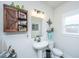Cozy bathroom featuring a decorative wooden cabinet and nautical themed decorations at 4314 Cotton Flt Rd, Summerville, SC 29485