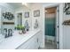Modern bathroom featuring double vanity, stylish decor, and a separate shower with an attractive curtain at 4314 Cotton Flt Rd, Summerville, SC 29485
