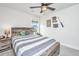 Comfortable bedroom showcasing a sports theme, wood-framed bed, and natural light at 4314 Cotton Flt Rd, Summerville, SC 29485