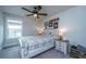 Comfortable bedroom featuring a neutral color scheme, ceiling fan, and natural light at 4314 Cotton Flt Rd, Summerville, SC 29485