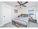 Cozy bedroom with sports theme decor, ceiling fan, and a bright window view at 4314 Cotton Flt Rd, Summerville, SC 29485