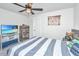 Comfortable bedroom featuring a ceiling fan, a baseball theme, and a television at 4314 Cotton Flt Rd, Summerville, SC 29485