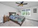 Comfortable bedroom with ceiling fan, dresser nightstand, and picturesque backyard view at 4314 Cotton Flt Rd, Summerville, SC 29485