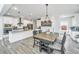 Inviting dining area with a modern light fixture, table, and seating for memorable meals at 4314 Cotton Flt Rd, Summerville, SC 29485