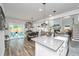 Open kitchen and dining area with access to the living room and outdoor patio at 4314 Cotton Flt Rd, Summerville, SC 29485