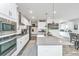 Open concept kitchen with an island, stainless steel appliances and white cabinetry at 4314 Cotton Flt Rd, Summerville, SC 29485