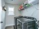 Well-equipped laundry room with modern washer and dryer units, complemented by a convenient storage shelf at 4314 Cotton Flt Rd, Summerville, SC 29485