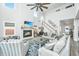 Bright living room with high ceilings, fireplace, ceiling fan, and comfortable seating at 4314 Cotton Flt Rd, Summerville, SC 29485