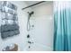 Bright shower features a modern shower head and a stylish blue to white gradient curtain at 4314 Cotton Flt Rd, Summerville, SC 29485