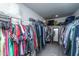 Spacious walk-in closet with ample hanging space, shelves, and a mirror, perfect for wardrobe organization at 4314 Cotton Flt Rd, Summerville, SC 29485