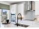 Modern kitchen features white cabinetry, stainless steel appliances, and sleek countertops, blending style with functionality at 455 White Magnolia St, Moncks Corner, SC 29461