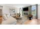 Spacious living room features a fireplace, large windows, and comfortable sectional sofa at 455 White Magnolia St, Moncks Corner, SC 29461