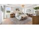 Spacious main bedroom offers a tranquil retreat with soft lighting, elegant decor, and a serene ambiance at 455 White Magnolia St, Moncks Corner, SC 29461