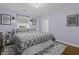 Cozy bedroom with a comfortable bed, stylish rug, and soft lavender walls at 4971 Edge Ave, Charleston, SC 29405