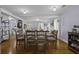 Elegant dining area with hardwood floors, seamlessly connected to the living space, perfect for entertaining at 4971 Edge Ave, Charleston, SC 29405