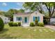 Attractive home with a well-maintained lawn, blue shutters, and a welcoming front porch, creating great curb appeal at 4971 Edge Ave, Charleston, SC 29405
