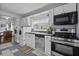 Efficient kitchen with modern appliances and ample counter space, complemented by the convenience of laundry facilities at 4971 Edge Ave, Charleston, SC 29405